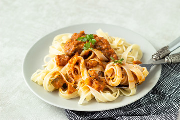 Vegetarian pasta (Tagliatelle) with zucchini, eggplant, bell pepper and tomato sauce.