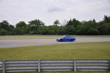 Blue Car on a Race Track
