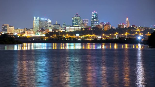 Kansas City Downtown Cityscape Timelapse at Night Overlooking the Missouri River with Lights Reflecting on the Water