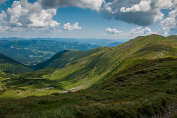 Obraz na płótnie Canvas Amazing mountain landscape in vivid sunny day, natural outdoor travel background. Dramatic and picturesque scene of Carpathian mountains in Ukraine.