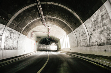 Travel in a mountain tunnel.