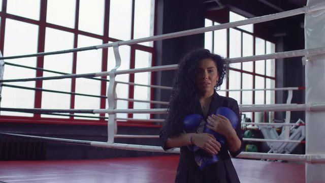 Beautiful irl hold a boxing glove in her hands