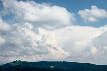 Obraz premium amazing beautiful view of mountains hills and valley on background of blue sky and clouds