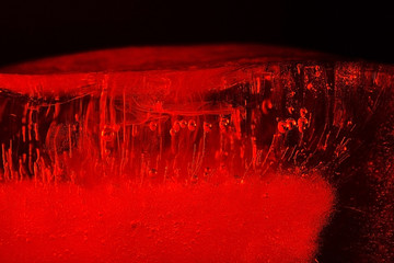 Air bubbles in red ice. Abstract background