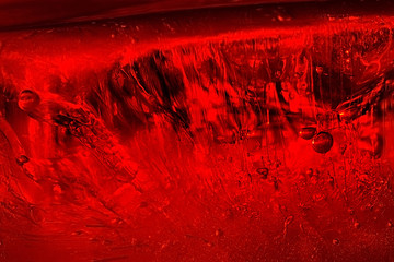 Air bubbles in red ice. Abstract background