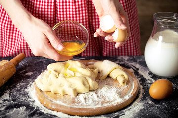 Making dough by female hands at bakery