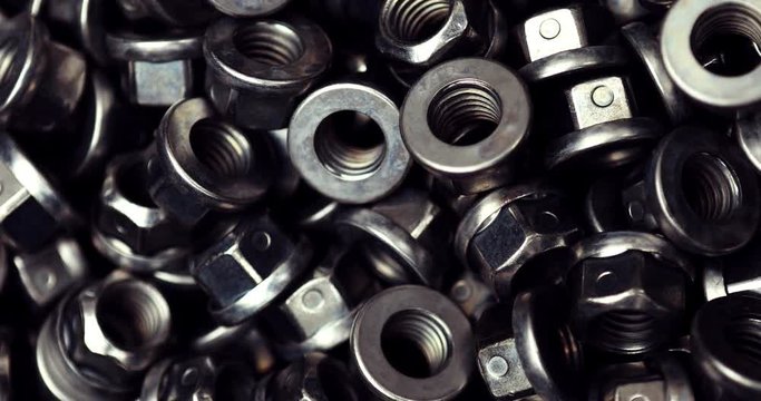Stack of metal nuts for background - macro video