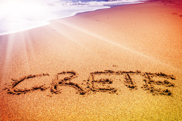 Crete inscription on the sand near the sea