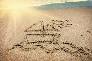 Ship painted on sand beach