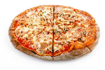 cut Pizza close up with cheese ham and tomato on a white stone background