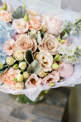 Beautiful summer bouquet. Arrangement with mix flowers. The concept of a flower shop. Work florist.