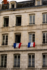 Obraz premium Flag of France Tricolour at Window