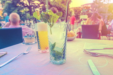 cocktails on hot summer day, mojito with ice, summer in the city