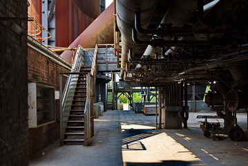 Detail of old rusty structural industrail factory. Concrete and steel structure of abandon former ironworks. Interior of rusty abandon factory atmosphere.