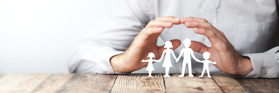 Protecting Hands Over Paper Family / Family Protection And Care Concept 