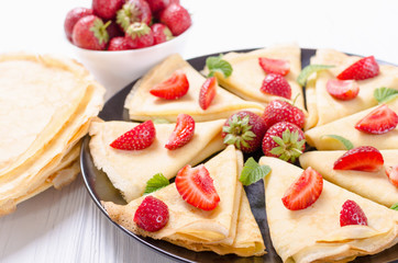 Homemade Russians pancakes with strawberry