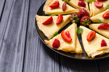 Homemade Russians pancakes with strawberry