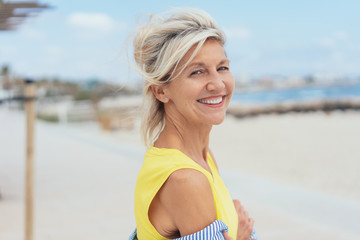 Attractive friendly woman at the seaside