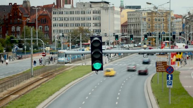 Time-lapse of a busy street in Eastern Europe with traffic light changing cycles