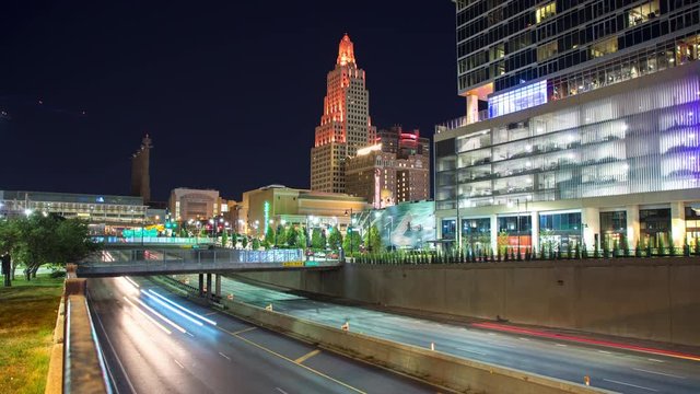 Kansas City Traffic Timelapse in Night Cityscape with Moving Lights from Driving Vehicles Streaking over Interstate Highway Lanes in a Vibrant Downtown Evening Scene