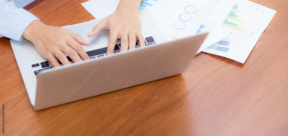 Poster closeup banner website work with finance analysis and planing data on laptop, typing and paper graph