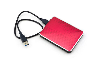 Red external hard drive with usb cable on the white background.
