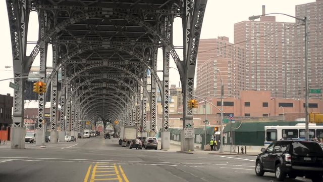 Bicycle rides under NYC Viaduct Bridge.