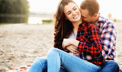 Loving couple have fun on the beach