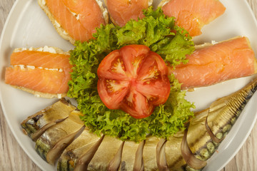 Sliced herring on a plate with herbs.