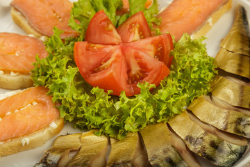 Sliced herring on a plate with herbs.