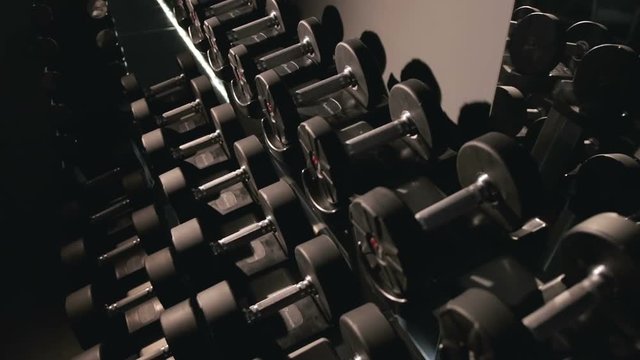 Set, a rack of dumbbells of different sizen for training, close-up