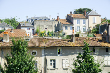 Streets and buildings of medieval french old town in summer on a sunny day