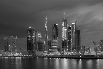 Fototapeta na wymiar DUBAI, UAE - MARCH 24, 2017: The evening skyline over the Canal and Downtown.