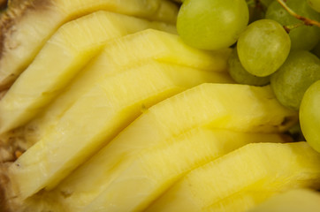 Very nice and artistically sliced fruits on a platter.