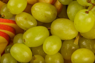 Very nice and artistically sliced fruits on a platter.
