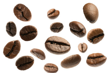 flying coffee beans isolated on white