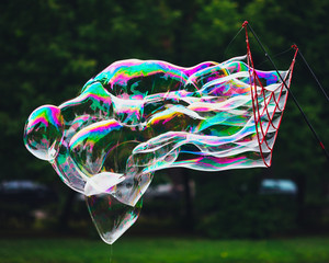 soap bubbles abstract shape, green background