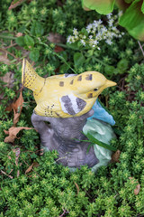 Whimsical Garden Art Decoration - Yellow Bird Perched On A Watering Jar