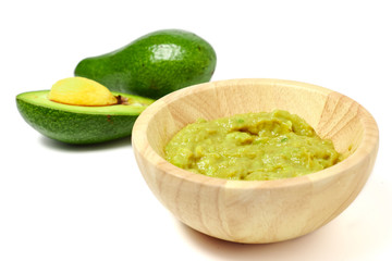 Guacamole sauce with avocado on white background