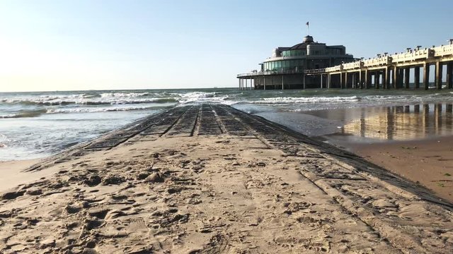 Waves crashing against a wavebreaker and the pillars of the Pier in the background. Clip shot in 4K 60fps and slightly colorgraded. Might need some stabilisation.