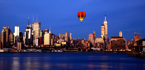 The Empire State Building lighting up red, white, and blue