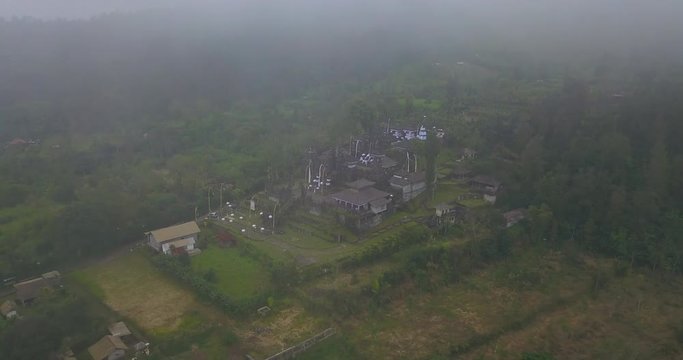 Aerial view from the cloudy weather at the small temple near Pura Besakih complex in the village of Besakih on the slopes of Mount Agung in eastern Bali