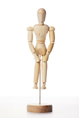 Wooden Dummy human sit down isolated white.