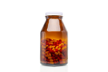 pills of capsule in glass bottle