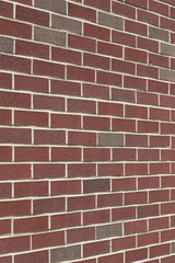 Fototapeta premium Rosy pink and gray traditional brick wall background (angle view)