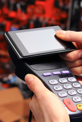 Using payment terminal for paying with smartphone, NFC technology