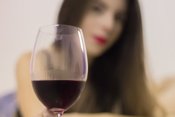 Sexy woman relaxing drinking wine.