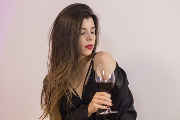 Sexy woman relaxing drinking wine.