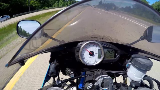 POV speeding motorcycle, weaving in and out of traffic, very fast, GoPro helmet cam, 1080p 24 fps.