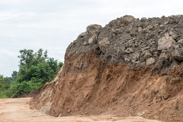 Sandy soil, which was dug with stones on top.
